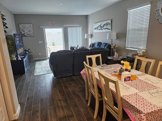View of a cozy dining area with tables and chairs