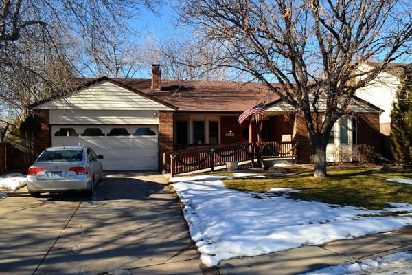 Exterior view of a senior living facility with outdoor space