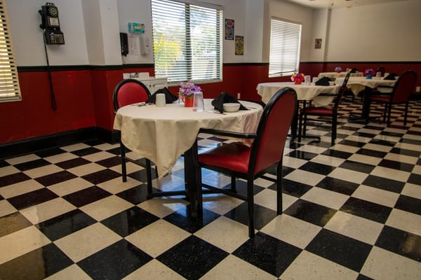 Dining room with tables set for a meal