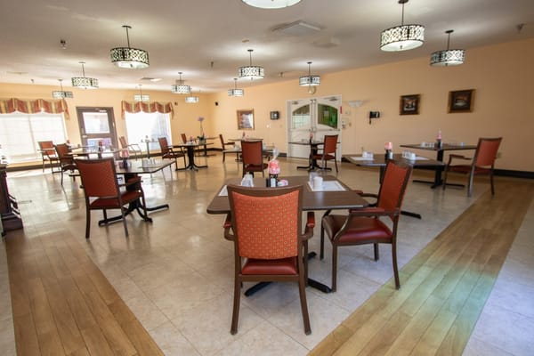 Dining area with tables and chairs arranged