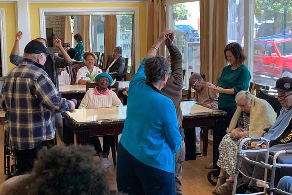 Residents engaging in a group activity in a common area