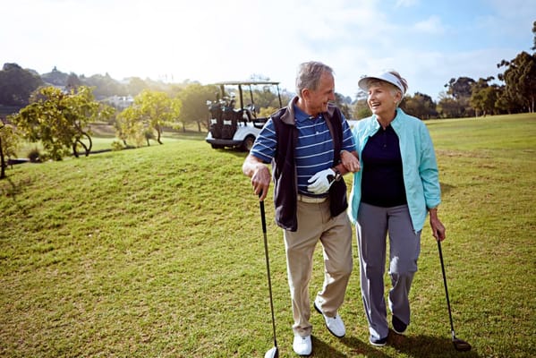 A couple enjoying a walk on the golf course