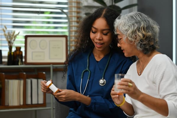 A nurse discussing medication with a resident