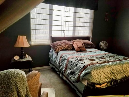 Cozy private bedroom with natural light