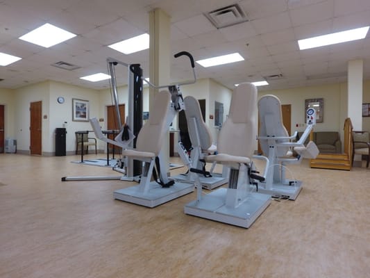 Well-equipped gym with fitness machines for residents