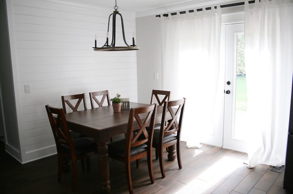 Bright dining room area with a wooden table