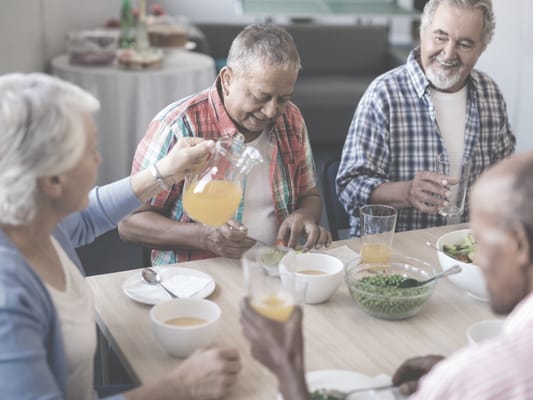 Residents enjoying a meal together in a dining area