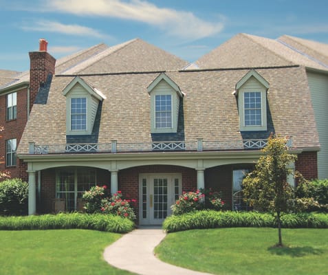 Exterior view of a senior living facility with landscaped walkways