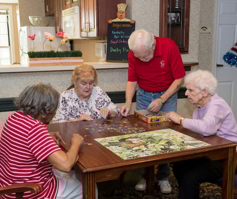 Residents engaging in a puzzle activity.