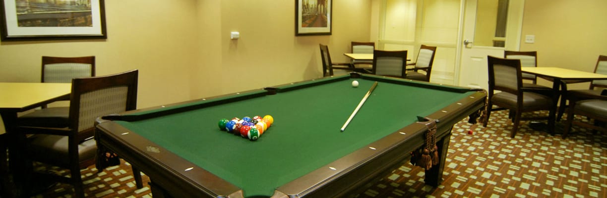 Interior of a game room with a pool table