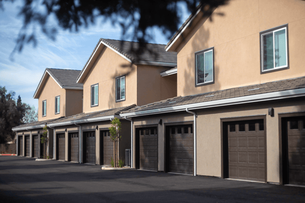 Exterior view of residential-style units with garages