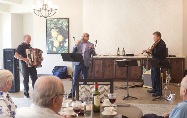 Residents enjoying a live music performance in the common area