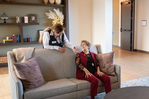 Staff member interacting with a resident in a lounge