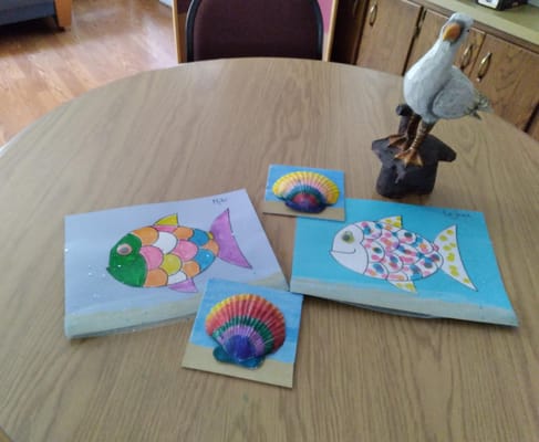 Colorful art projects displayed on a table