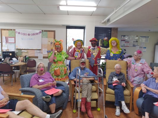 Residents enjoying a fun event with clowns