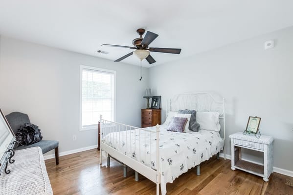 Cozy resident room with bedding and decor