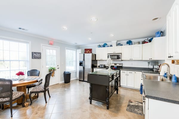 Bright and modern kitchen interior with dining table