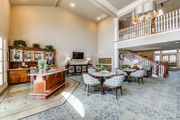 Common area with seating and decor in a bright lobby