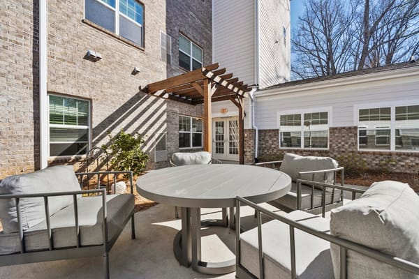 Outdoor seating area with chairs and table