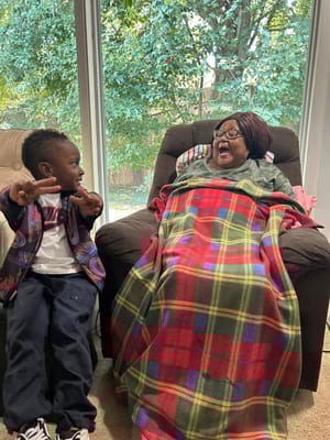 Two residents enjoying a moment in a cozy interior setting