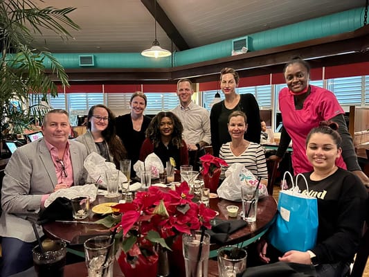 Staff and residents enjoying a meal together in the dining area