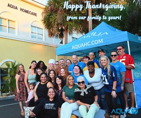 Group photo of staff and residents celebrating Thanksgiving at Aqua Home Care