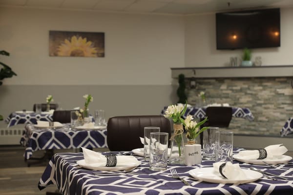 Dining area set up with elegant tables and decorations
