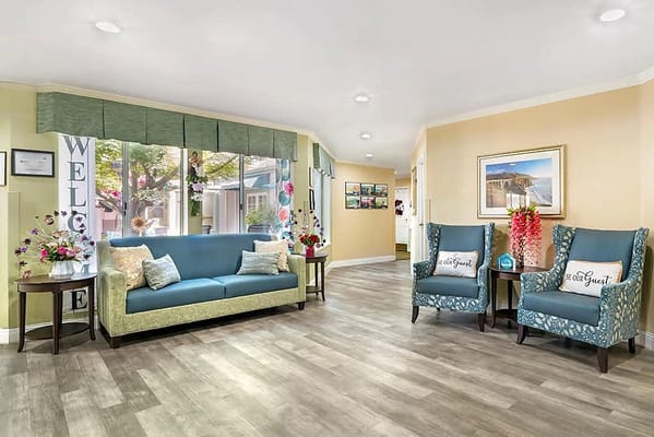 Inviting living room with seating and decorative flowers