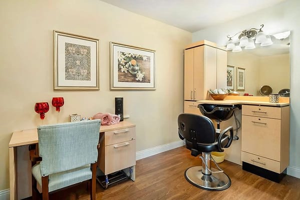 Hair salon space with a chair and furnishings