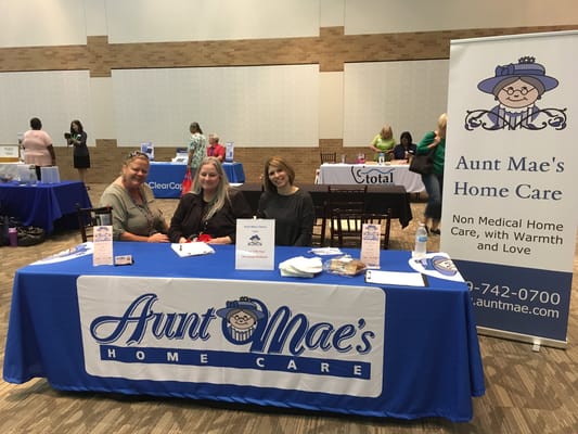 Three staff members at a facility event