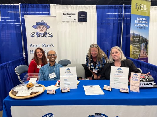 Staff members engaging with visitors at an informational booth
