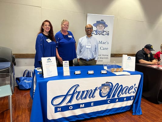 Staff members at a home care facility booth