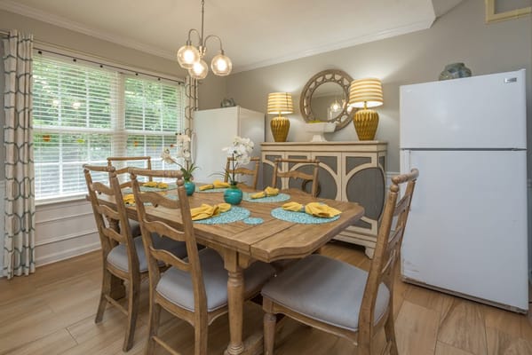 Bright dining area with a table set for a meal