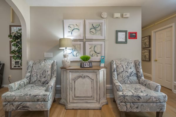 Comfortable common area with decorative chairs
