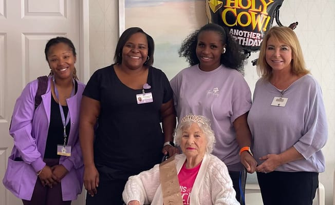 Staff and resident celebrating a birthday together