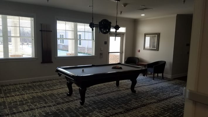 Pool table in a bright common area