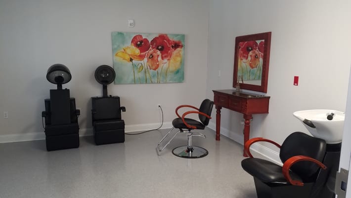 Interior view of a salon area with styling chairs