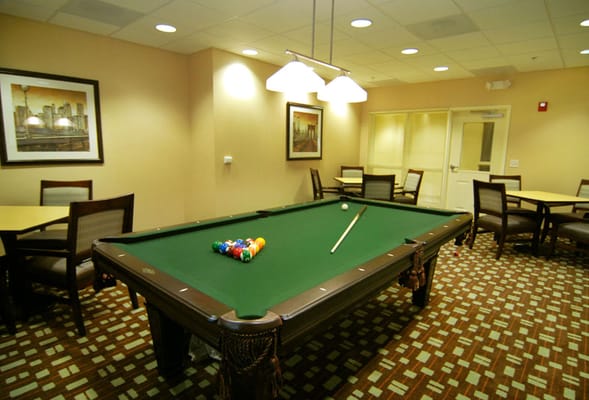 Interior of a game room with a pool table