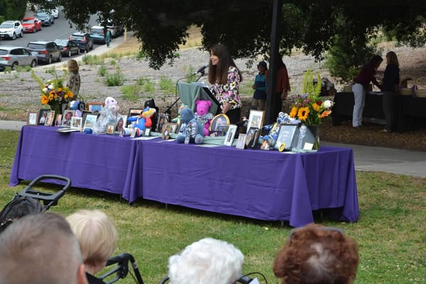 Residents and staff celebrating at an outdoor event