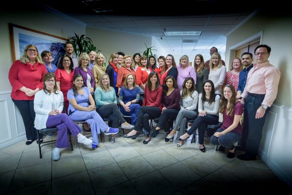 Group photo of staff members in an interior setting
