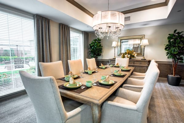 Elegant dining room with a long table set for a meal