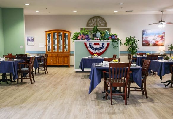 Dining area set up for residents with flowers