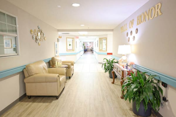 Hallway with seating and decor in a senior living facility