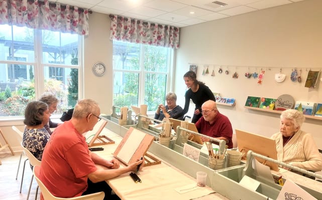 Residents participating in an art activity class