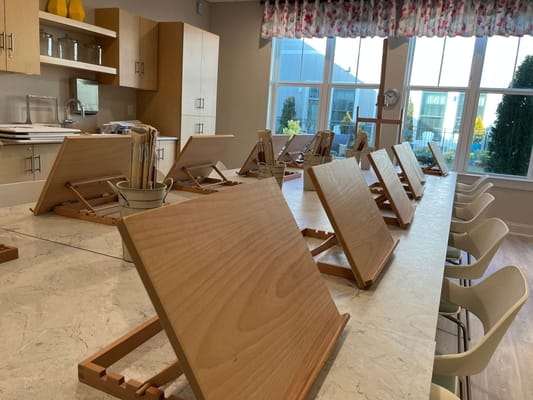 Interior view of a communal space with wooden boards