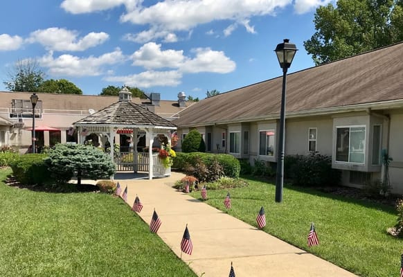 Outdoor view of a senior living facility with a gazebo