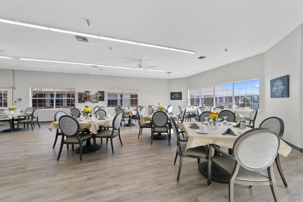 Bright dining room with tables set for dining