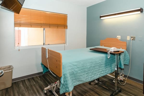 A private resident room with a hospital bed