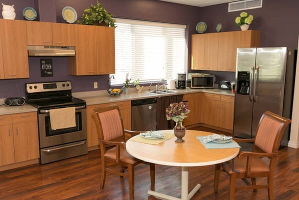 Bright kitchen with wooden cabinets and dining table