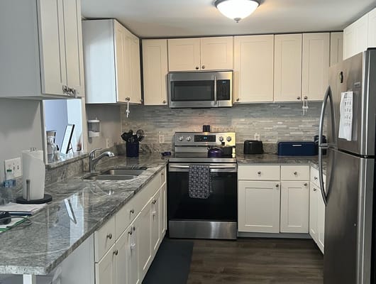 Modern kitchen with granite countertops and stainless steel appliances